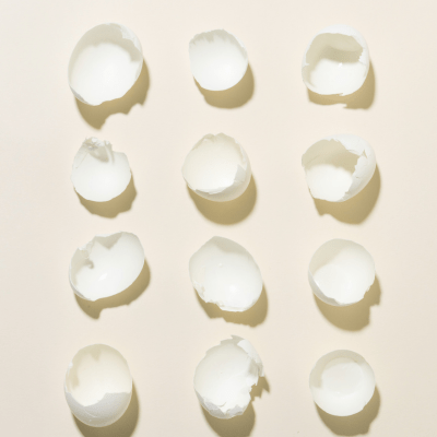 Collagen+ Shot of White Egg Shells 4x3 on a beige background